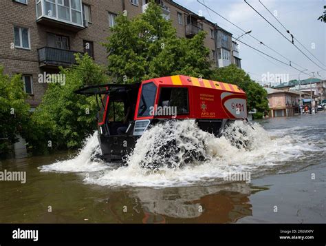 A Specialized Rescue Vehicle Breaches The Flood Waters Of Kherson