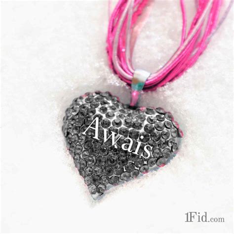 A Black And White Heart Shaped Pendant With The Word Salman On Its Side