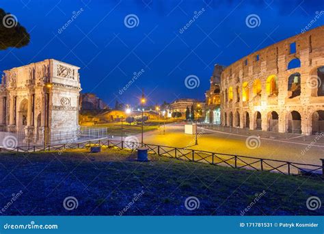 Arch Of Constantine And The Colosseum Illuminated At Night In Rome