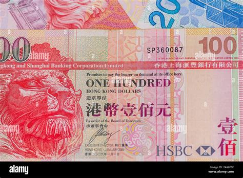 Hong Kong Currency And Hsbc Bank Emblem In Hong Kong Stock