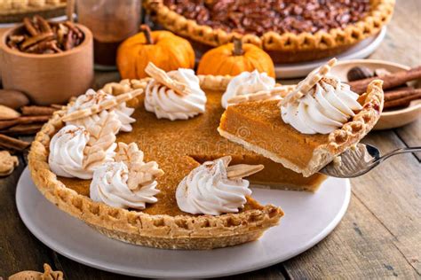 Traditional Thanksgiving Pumpkin Pie Topped With Whipped Cream Stock