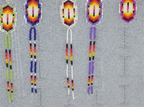 Items similar to Beaded Native American Feather Earrings with Swarovski ...