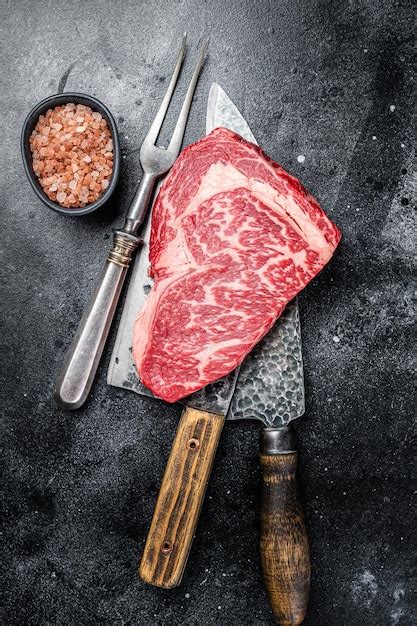 Premium Photo Butcher Table With Wagyu Rib Eye Steak Raw Beef Meat