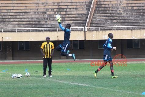 Goalkeeper Head Coach Fred Kajoba Watches As Robert Ondongkara Goes