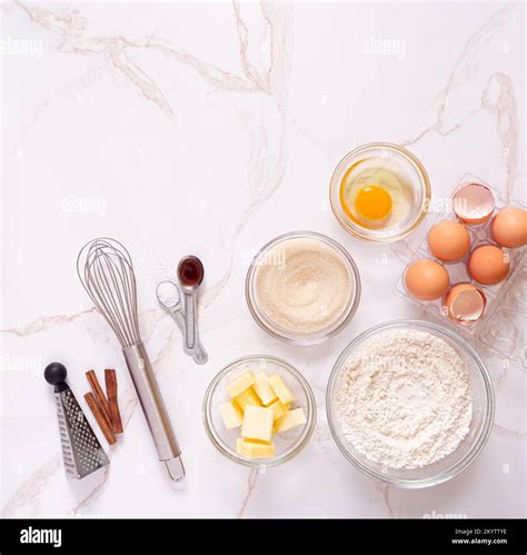 Overhead View Of Raw Baking Ingredients For Snickerdoodle Cookies To Include Eggs Sugar Flour