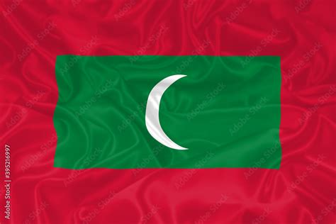 Maldives Flag waving. National flag of Maldives with waves and wind ...