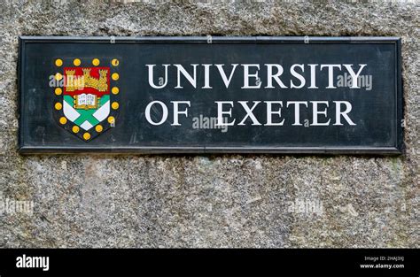 University of Exeter sign and coat of arms (crest) at entrance to Streatham Campus, Exeter Stock ...