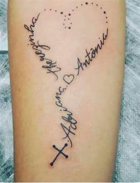 A Heart Shaped Tattoo With The Names Of Two People And One Is Written