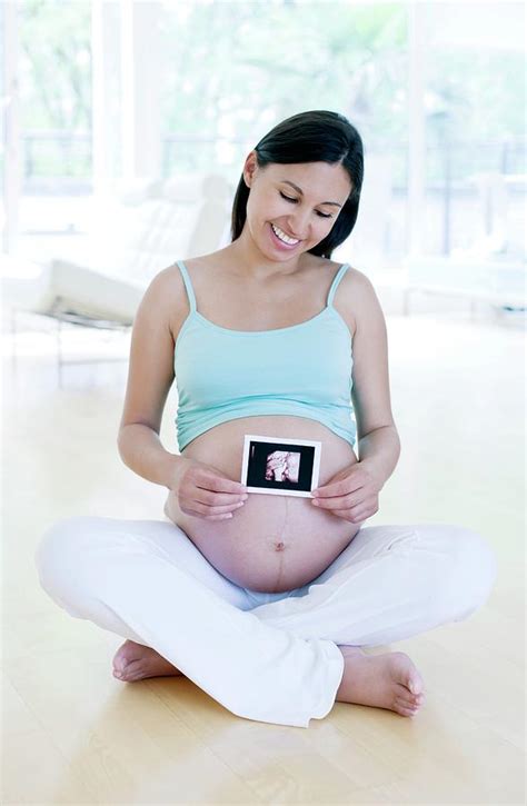 Pregnant Woman Holding Her Baby Scan Photograph By Ian Hooton Science