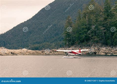 Dehavilland Beaver Float Plane Going Through A Cut In An An Island