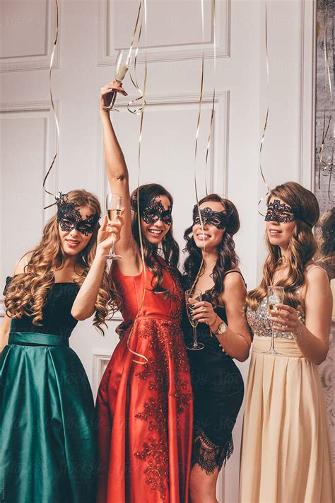 Smiling Women Holding Glasses Del Colaborador De Stocksy Andrey