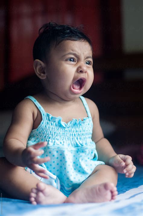 "Cute Baby Girl Crying" by Stocksy Contributor "Saptak Ganguly" - Stocksy