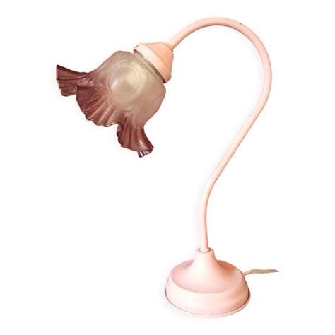 A Pink Lamp With A Bird On It S Side And A Light Bulb In The Shape Of A