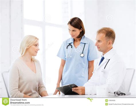 Doctor and Nurse with Patient in Hospital Stock Image - Image of ...