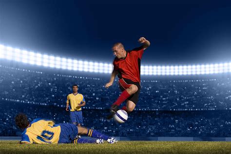 Soccer Player Jumping With Ball Photograph By Kycstudio Fine Art America