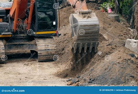 Backhoe Working By Digging Soil At Construction Site Bucket Teeth Of