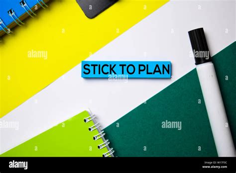 Stick To Plan Text On Sticky Notes With Office Desk Concept Stock Photo