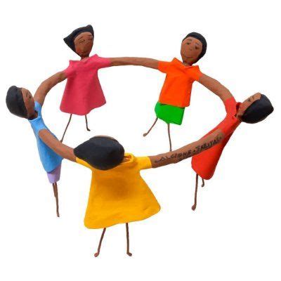 Three Wooden Dolls Holding Hands In A Circle