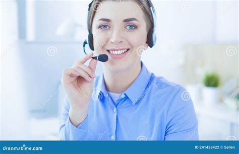 Serious Pretty Young Woman Working As Support Phone Operator With