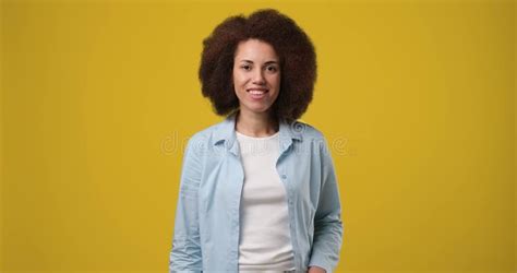 Young Happy Smiling African American Woman Typing A Text Message On A