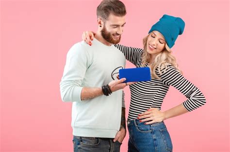 Premium Photo Young Attractive Couple Listening To Music On Wireless