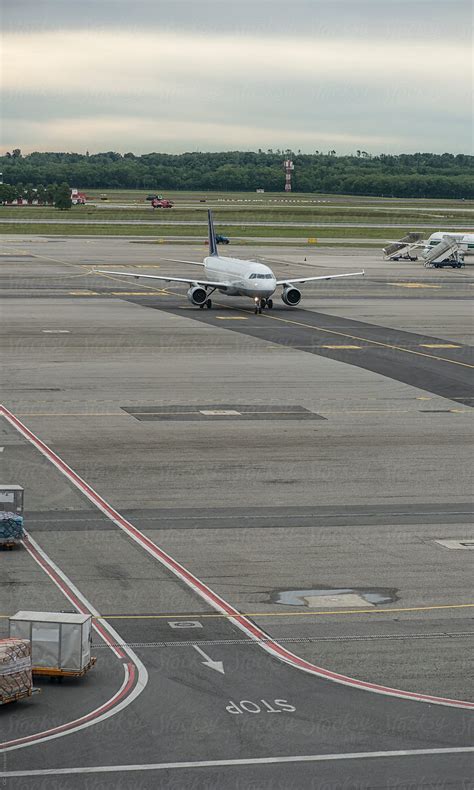 Airplane Landing In Airport Del Colaborador De Stocksy Simone Wave