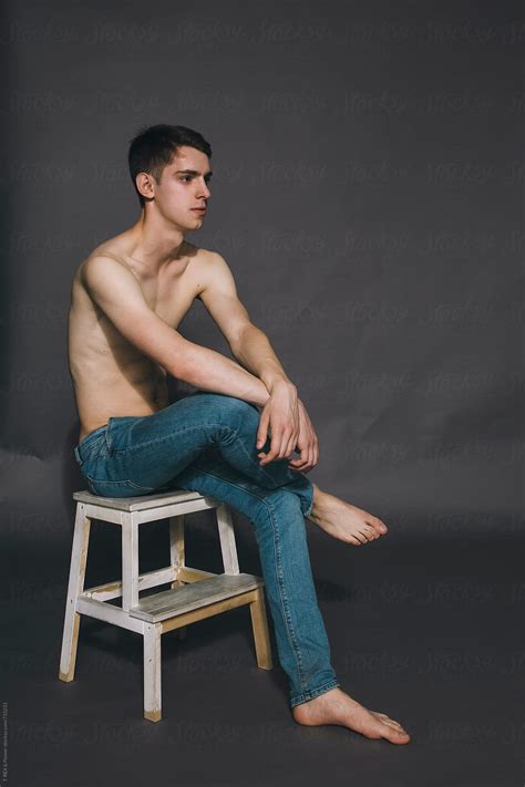 Naked Guy Sitting On Stepladder In The Studio By Stocksy Contributor