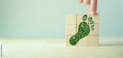 Carbon Footprint, zero emission concept. Carbon ecological footprint symbols on wooden cubes ...