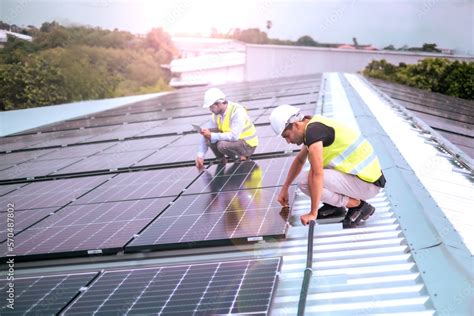 Foreman checking last step or taking care solar cell plate after ...