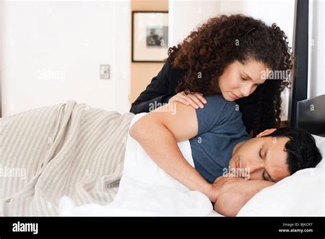 Woman Watching Man Sleeping In Bed Stock Photo Alamy