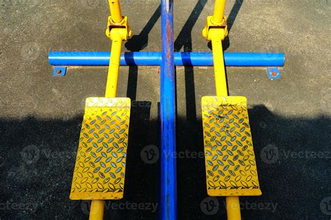Close up Yellow Pedal of Leg Swings Exercise Machine. 21486003 Stock