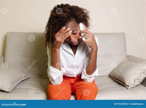 Shocked African American Woman Receiving Bad News At Phone Stock Photo