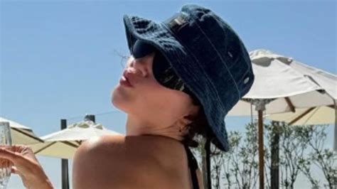 Pop Star S Sister Shares Bikini Clad Holiday Snap Of Herself But Can YOU Guess Who Her Famous