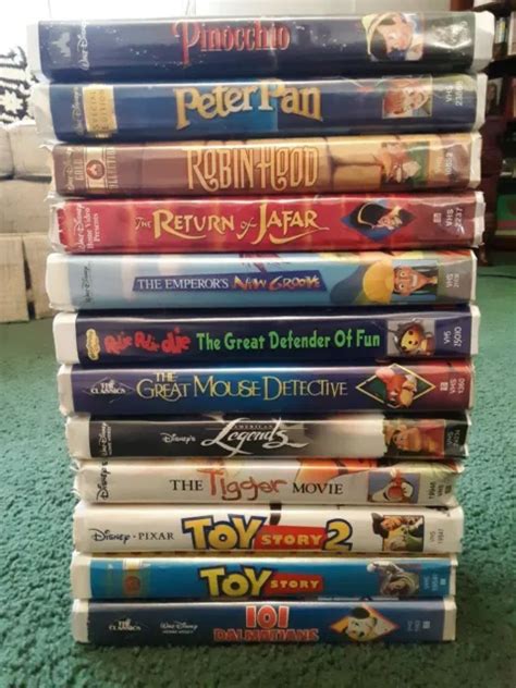 LOT DE 12 films VHS Walt Disney étuis à clapet Peter pan jouet