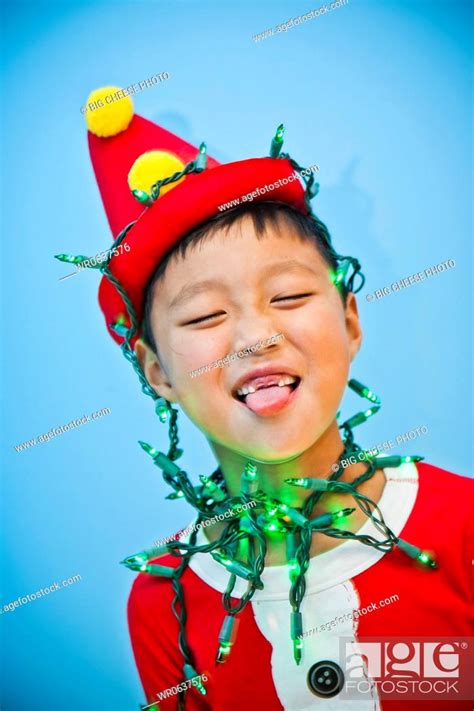 Boy in red costume with holiday lights, Stock Photo, Picture And Royalty Free Image. Pic ...