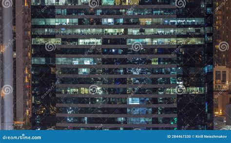 Office Buildings Windows Illuminated At Night Timelapse Stock Photo