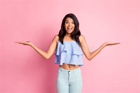 Photo Of Impressed Brunette Lady Hold Empty Space Wear Blue Top Pants