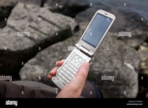 A 'flip phone', also known as a 'feature phone' Stock Photo - Alamy