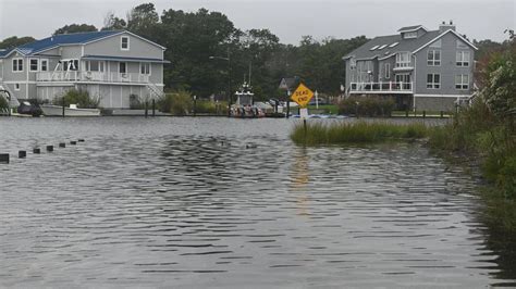 Cleanup starts after torrential downpours flooded streets, forced ...