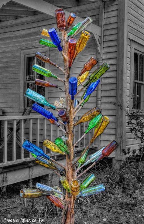 The Crafts Of Glass Bottles Bottle Tree Bottle Trees Garden Crafts