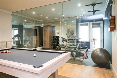 Sliding Glass Door On Rails Separates A Well Appointed Home Gym From A