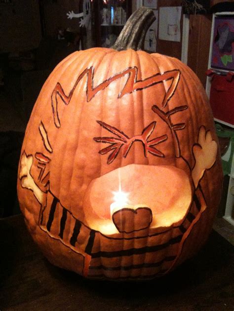 a pumpkin carved to look like a cat