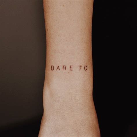 Dare To Lettering Tattoo On The Wrist