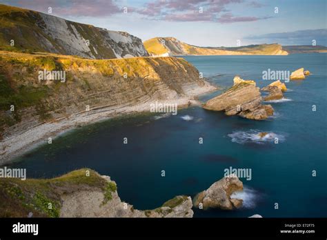 Setting Sunlight Over Mupe Bay Along The Jurassic Coast Near Lulworth