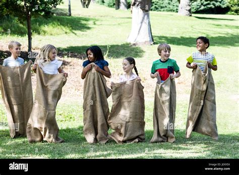 children   sack race  park stock photo alamy