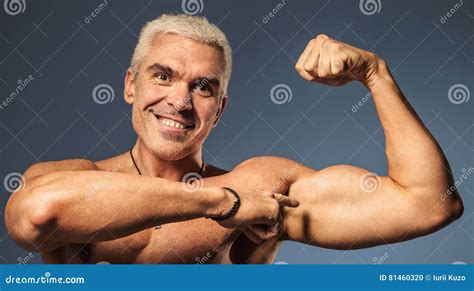 Strong Man Fitness Model Showing Flexing Bicep Muscle Healthy L Stock