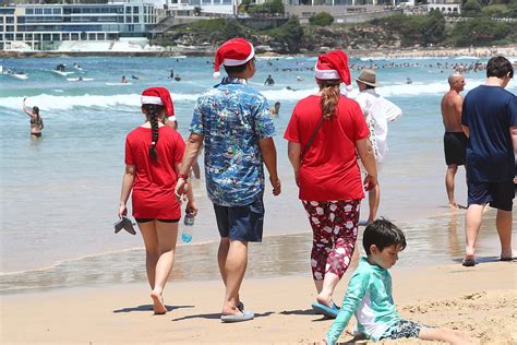 Thousands Of Aussies Embrace The Christmas Season And Hit Bondi Beach