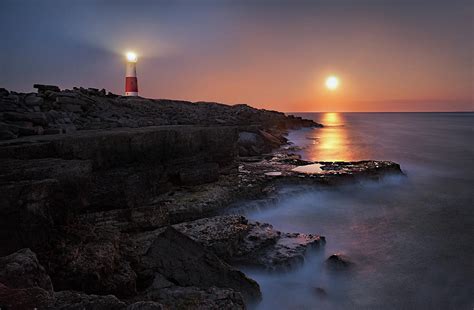 Lighthouse In Moonlight by Getty Images