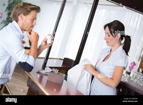 waitress serving coffee  coffee shop  client stock photo alamy