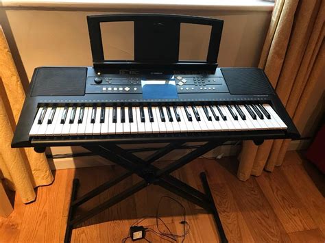 Yamaha PSR E333 Digital Portable Keyboard Piano And Folding Stand